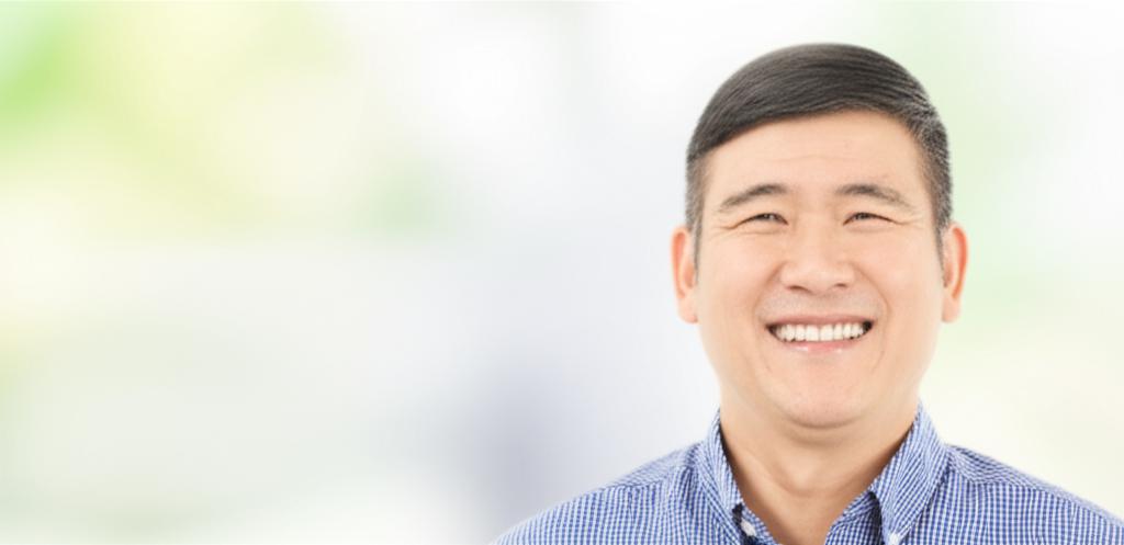 ai prompt: illustration of a middle-aged asian man smiling confidently, looking healthy and relieved, bright background, thai man